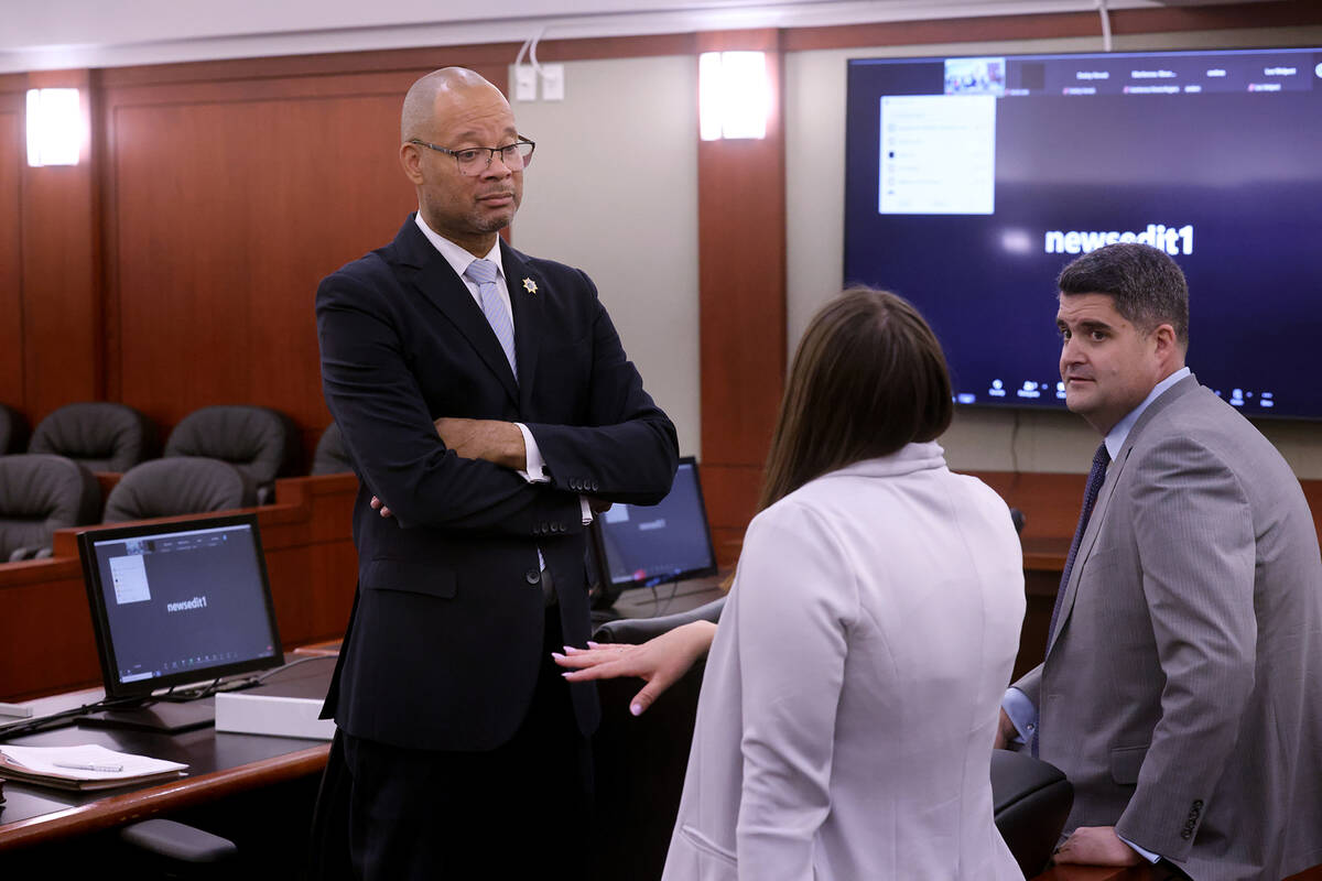 Attorney General Aaron Ford, left, meets with Chief Deputy Attorney General Alissa Engler and M ...