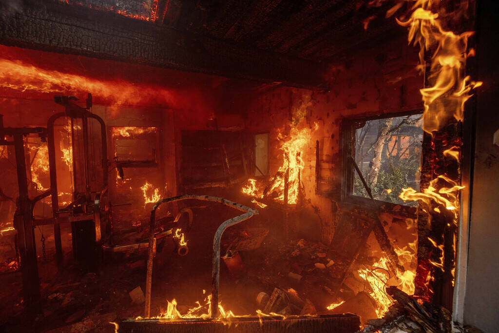 CORRECTS BYLINE FROM ETIENNE LAURENT TO ETHAN SWOPE - The Palisades Fire burns a residence in t ...
