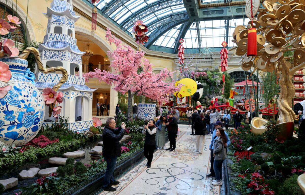 Guests take in the Year of the Snake celebrating Lunar New Year at Bellagio Conservatory & Bota ...