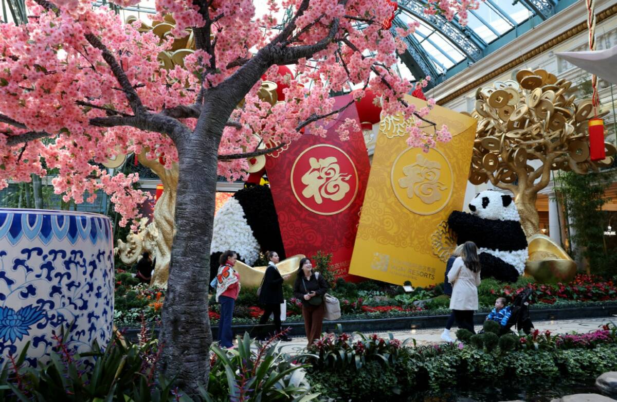 Guests take in the Year of the Snake celebrating Lunar New Year at Bellagio Conservatory & Bota ...