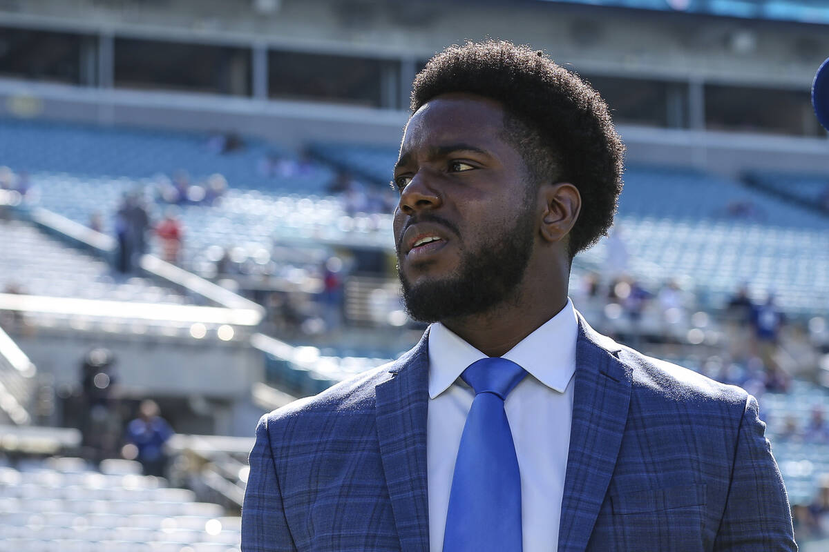 New York Giants assistant general manager Brandon Brown walks the sideline during warm-ups befo ...