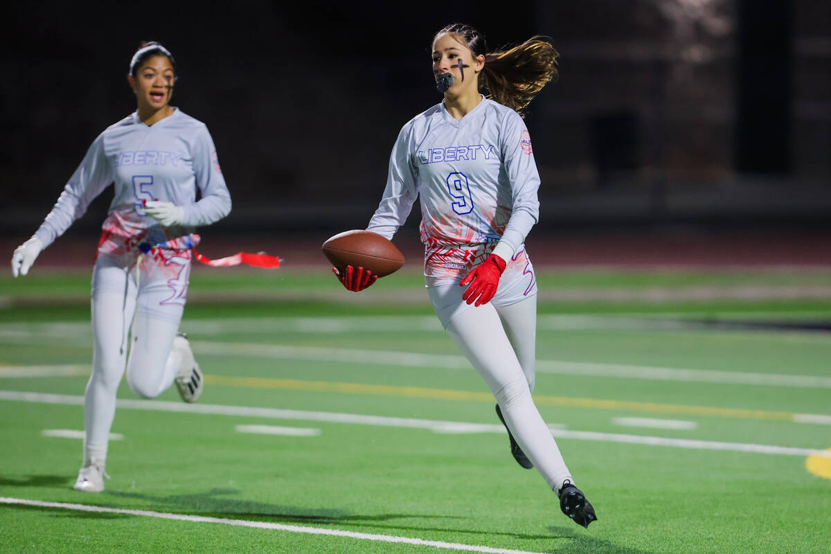 Liberty linebacker Nale’a Pomaikai runs the ball during a high school girls flag footbal ...