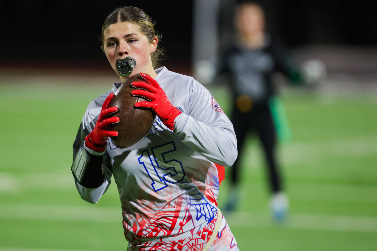 Liberty wide receiver Brinlee Yurek runs the ball during a high school girls flag football game ...
