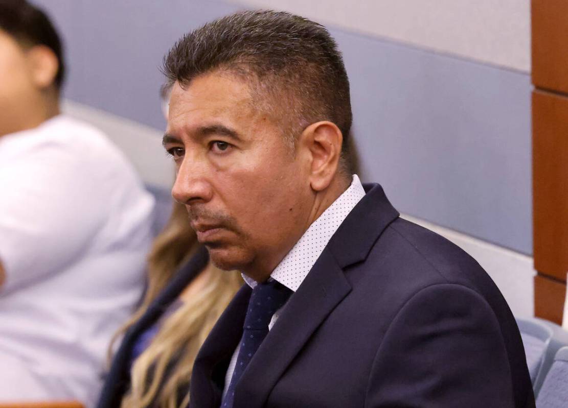 Former Alpine Motel Apartments owner Adolfo Orozco-Garcia, right, waits to apper in Clark Count ...