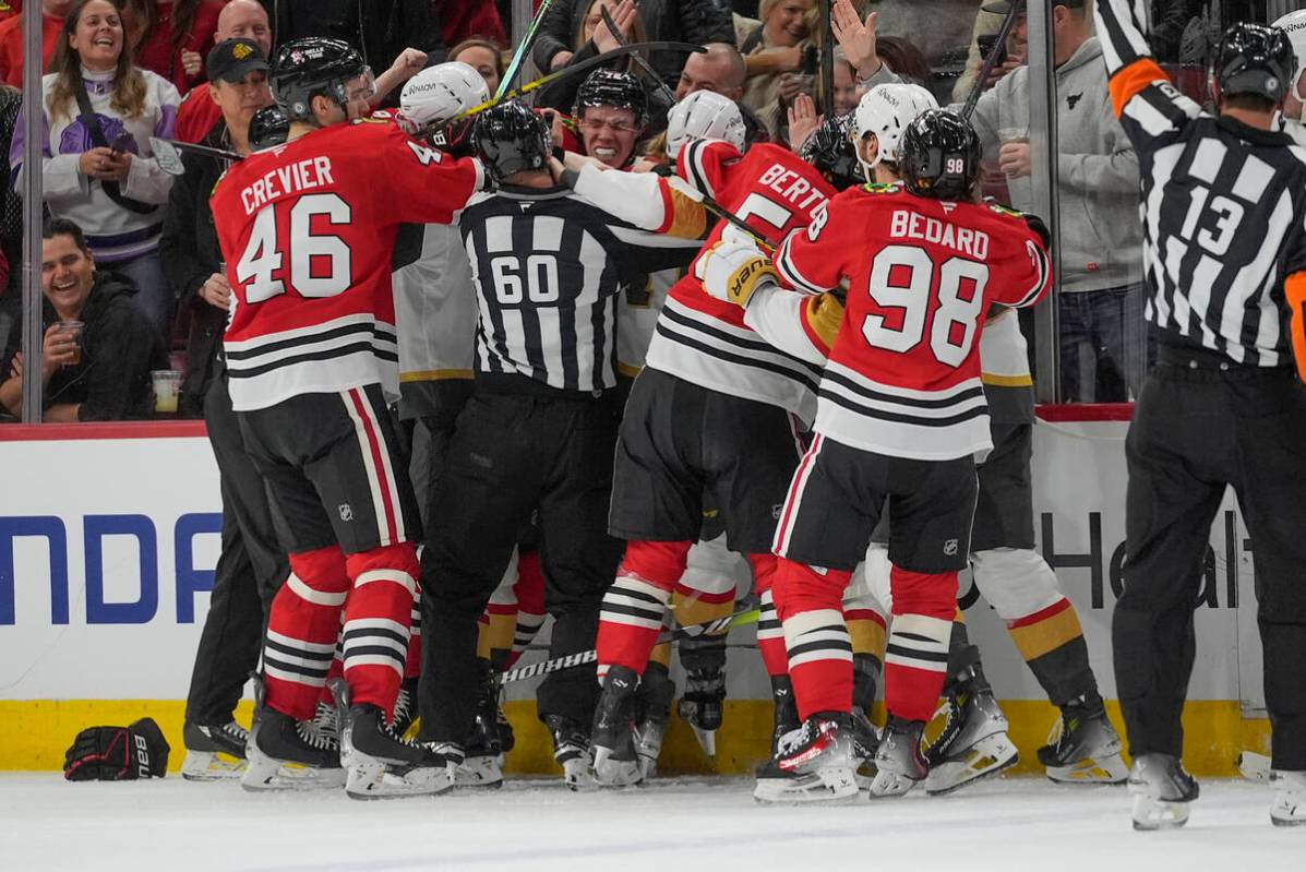 The Vegas Golden Knights and the Chicago Blackhawks fight during the second period of an NHL ho ...