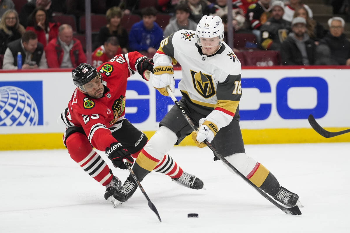Chicago Blackhawks defenseman Alec Martinez (25), left, and Vegas Golden Knights left wing Pave ...