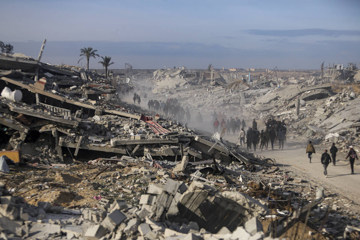 Displaced Palestinians leave parts of Khan Younis as they go back to their homes in Rafah, sout ...