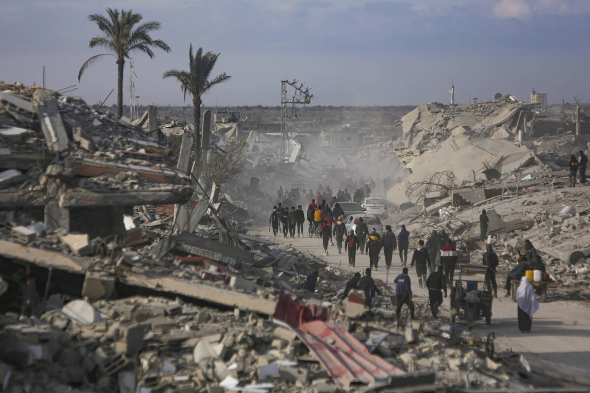 Displaced Palestinians leave parts of Khan Younis as they go back to their homes in Rafah, sout ...