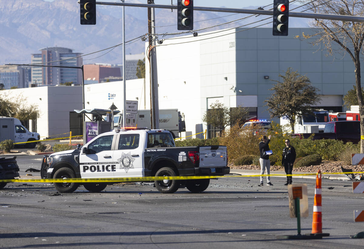 Las Vegas police investigate the scene of a crashed car at Charleston Boulevard and Pecos Road, ...