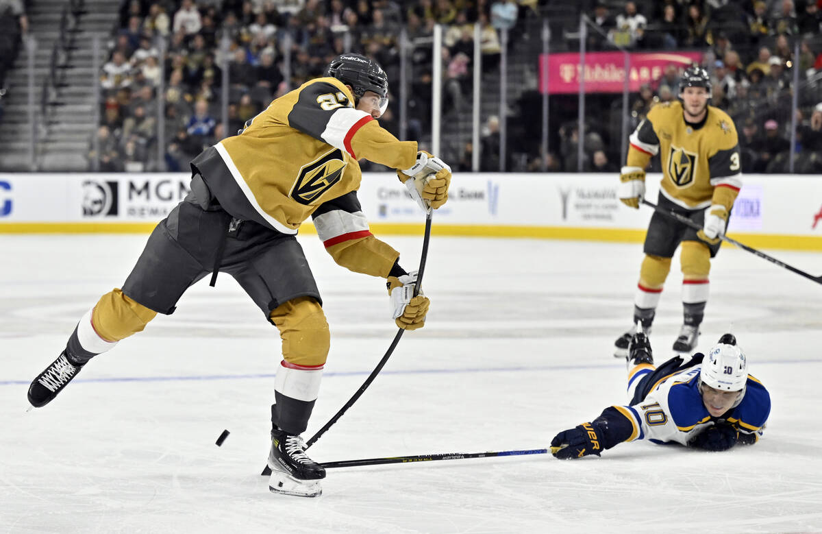 St. Louis Blues center Brayden Schenn (10) breaks up a shot by Vegas Golden Knights defenseman ...