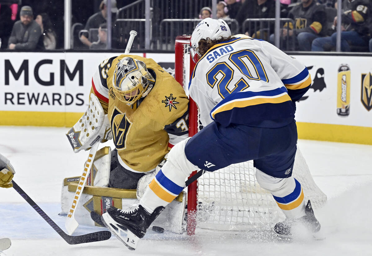 Vegas Golden Knights goaltender Adin Hill (33) stops the puck against St. Louis Blues left wing ...