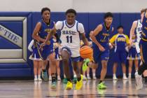 Basic guard JaMari Cottingham (11) drives the ball against Sierra Vista during a basketball gam ...