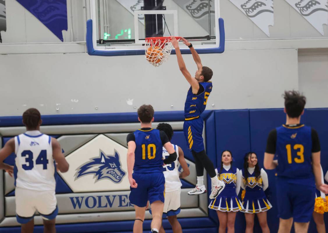 Sierra Vista guard Noah Brosier dunks the ball during a basketball game at Basic Academy on Mon ...