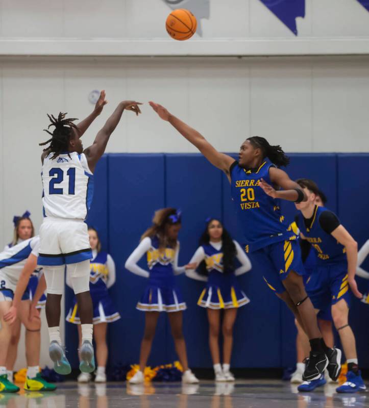 Basic guard Kenny Williams (21) shoots over Sierra Vista forward Darius Ruffin (20) during a ba ...