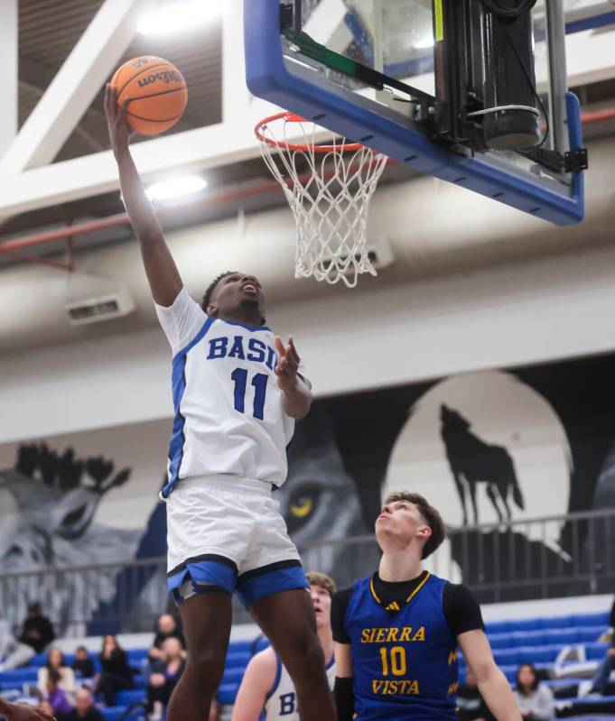 Basic guard JaMari Cottingham (11) lays up the ball in front of Sierra Vista forward Colton Kno ...