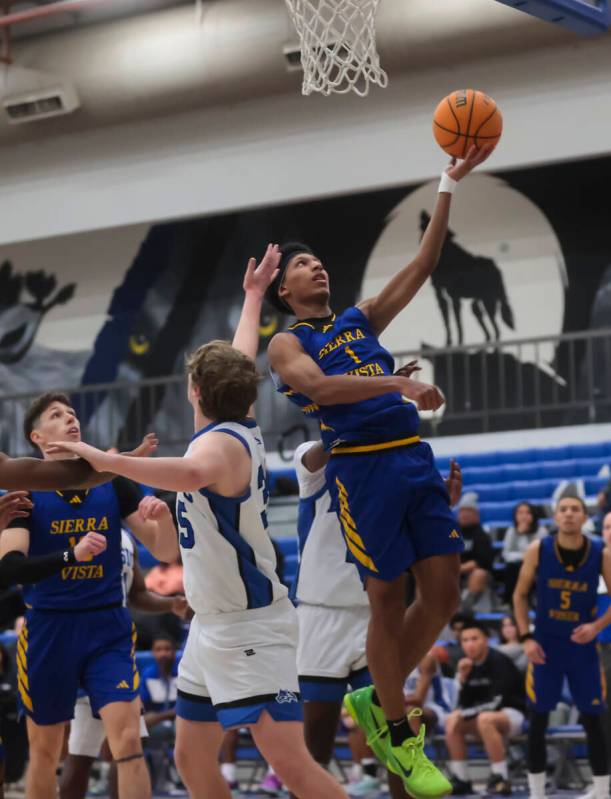 Sierra Vista guard Jevon Yapi (1) lays up the ball during a basketball game at Basic Academy on ...
