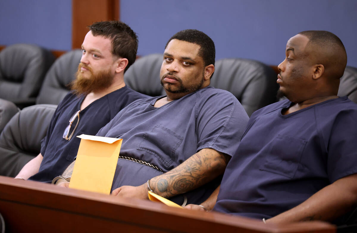 Clarence Martin Jr., center, appears in court for sentencing at the Regional Justice Center in ...