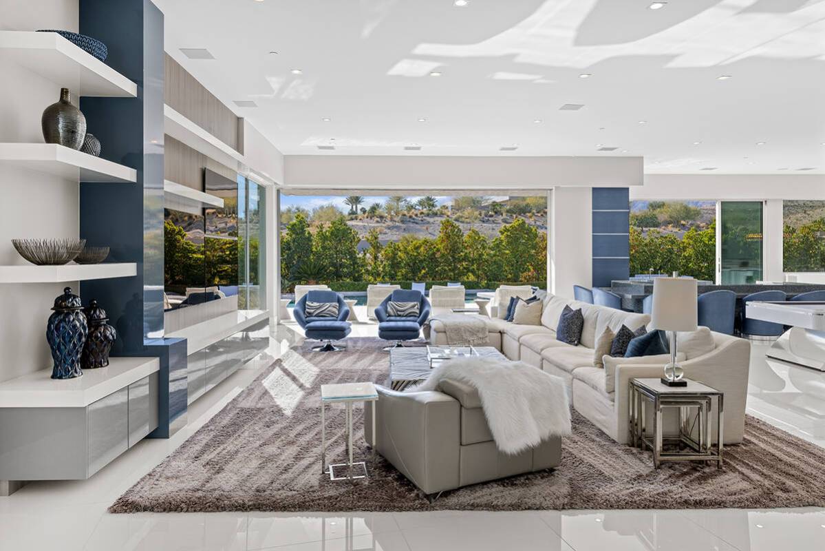 The home has five bedrooms, five full baths, four half baths and a four-car garage. It was buil ...