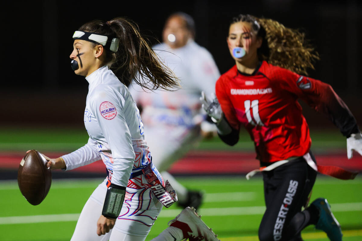 Liberty quarterback Kaylie Phillips (14) runs the ball during a flag football game between Libe ...