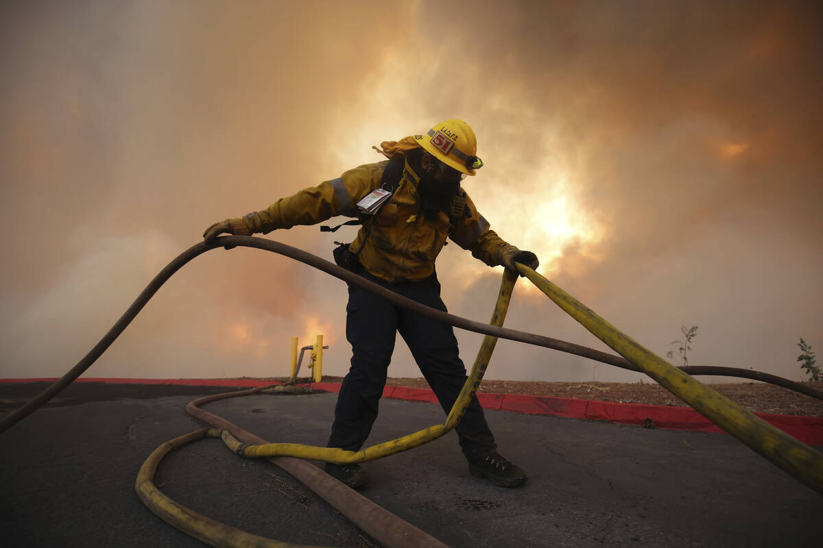 Firefighters battle to maintain upper hand on huge fire north of LA