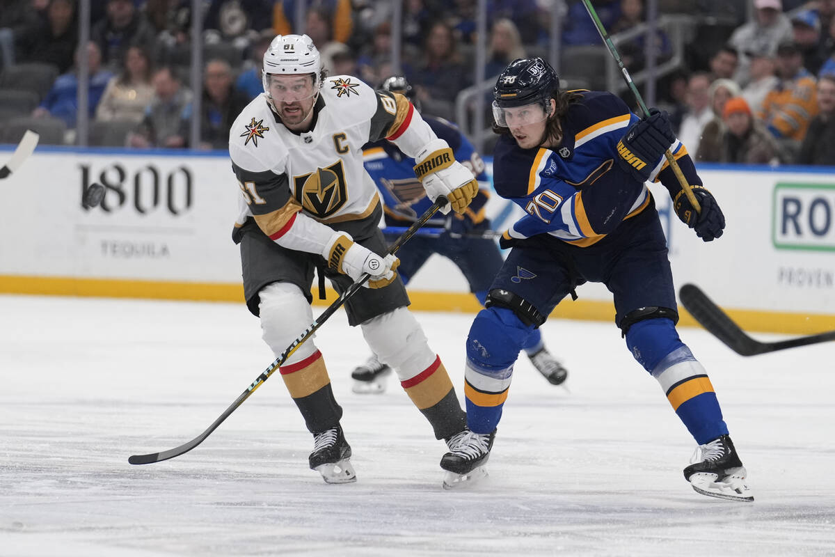 Vegas Golden Knights' Mark Stone (61) and St. Louis Blues' Oskar Sundqvist (70) chase after a l ...