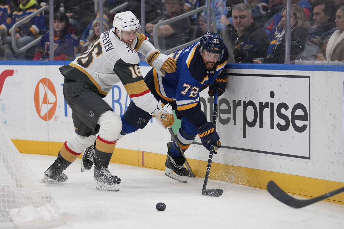 Vegas Golden Knights' Pavel Dorofeyev (16) and St. Louis Blues' Justin Faulk (72) chase after a ...