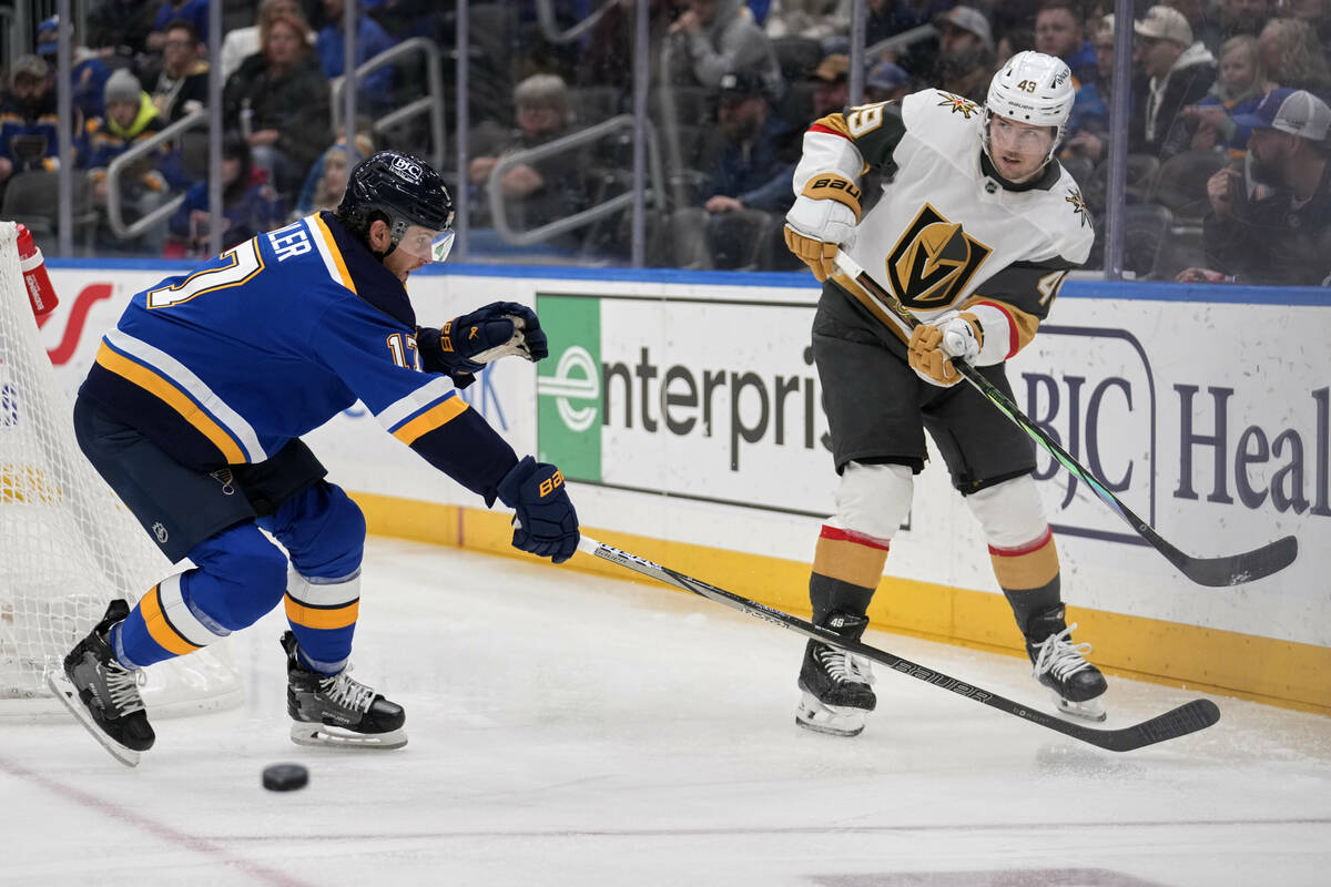 Vegas Golden Knights' Ivan Barbashev, right, passes around St. Louis Blues' Cam Fowler (17) dur ...