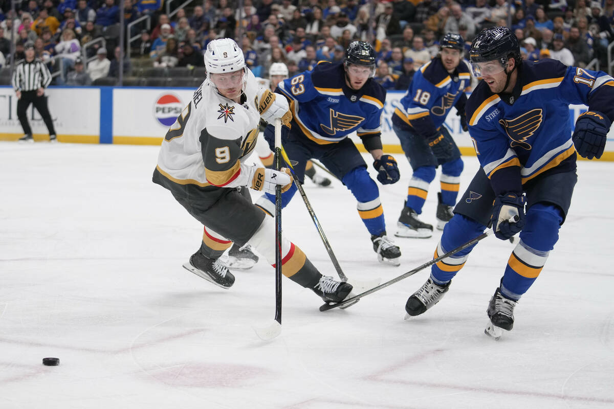 Vegas Golden Knights' Jack Eichel (9) chases after a loose puck as St. Louis Blues' Jake Neighb ...