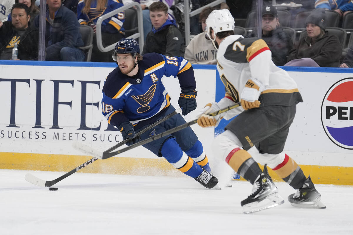 St. Louis Blues' Robert Thomas (18) handles the puck as Vegas Golden Knights' Alex Pietrangelo ...