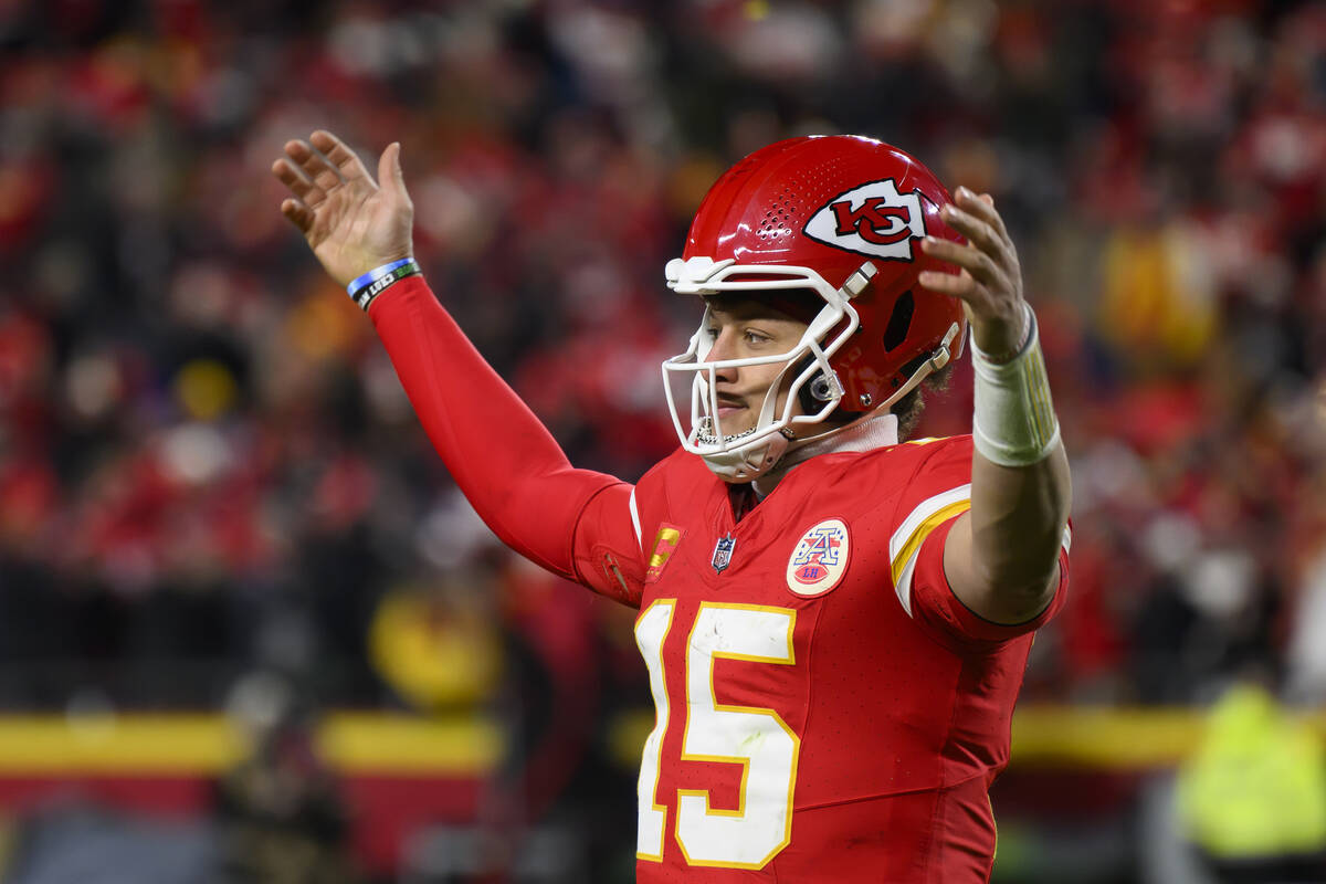 Kansas City Chiefs quarterback Patrick Mahomes urges the crowd to make noise as time runs down ...