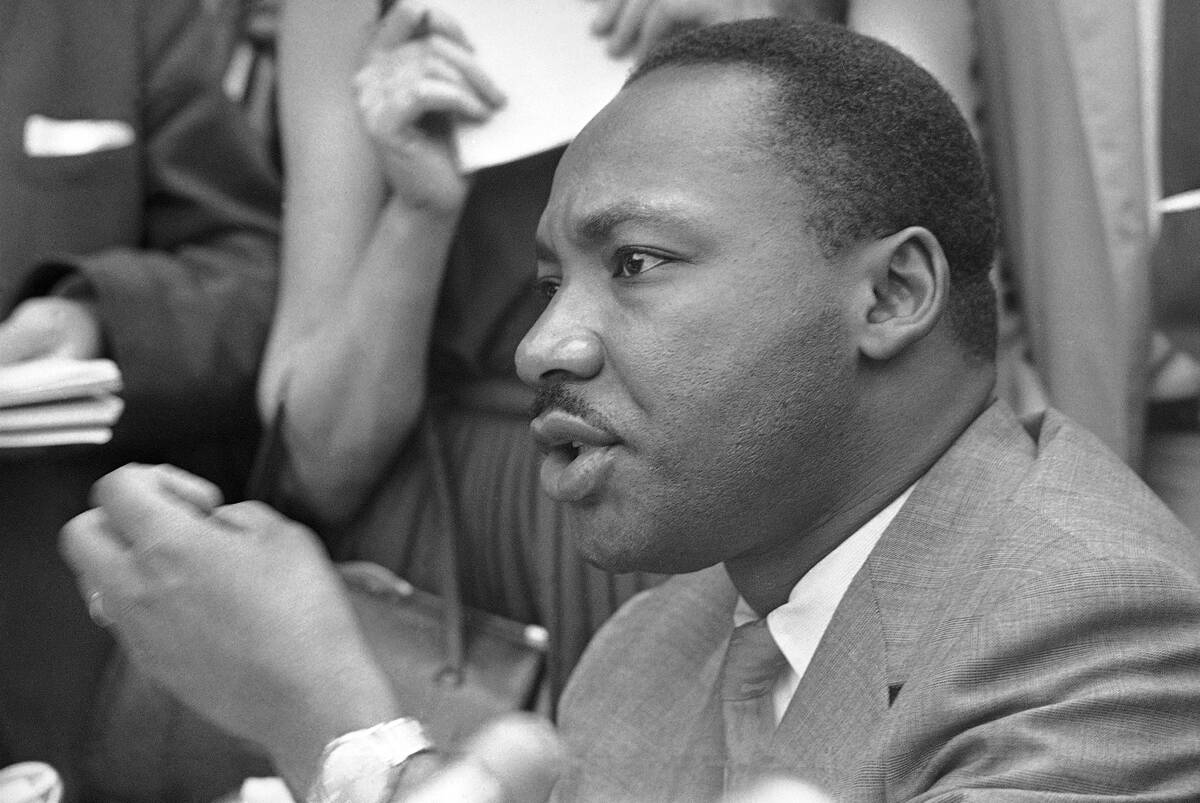 FILE - Rev. Martin Luther King Jr., speaks to reporters in Birmingham, Ala., May 9, 1963. (AP P ...