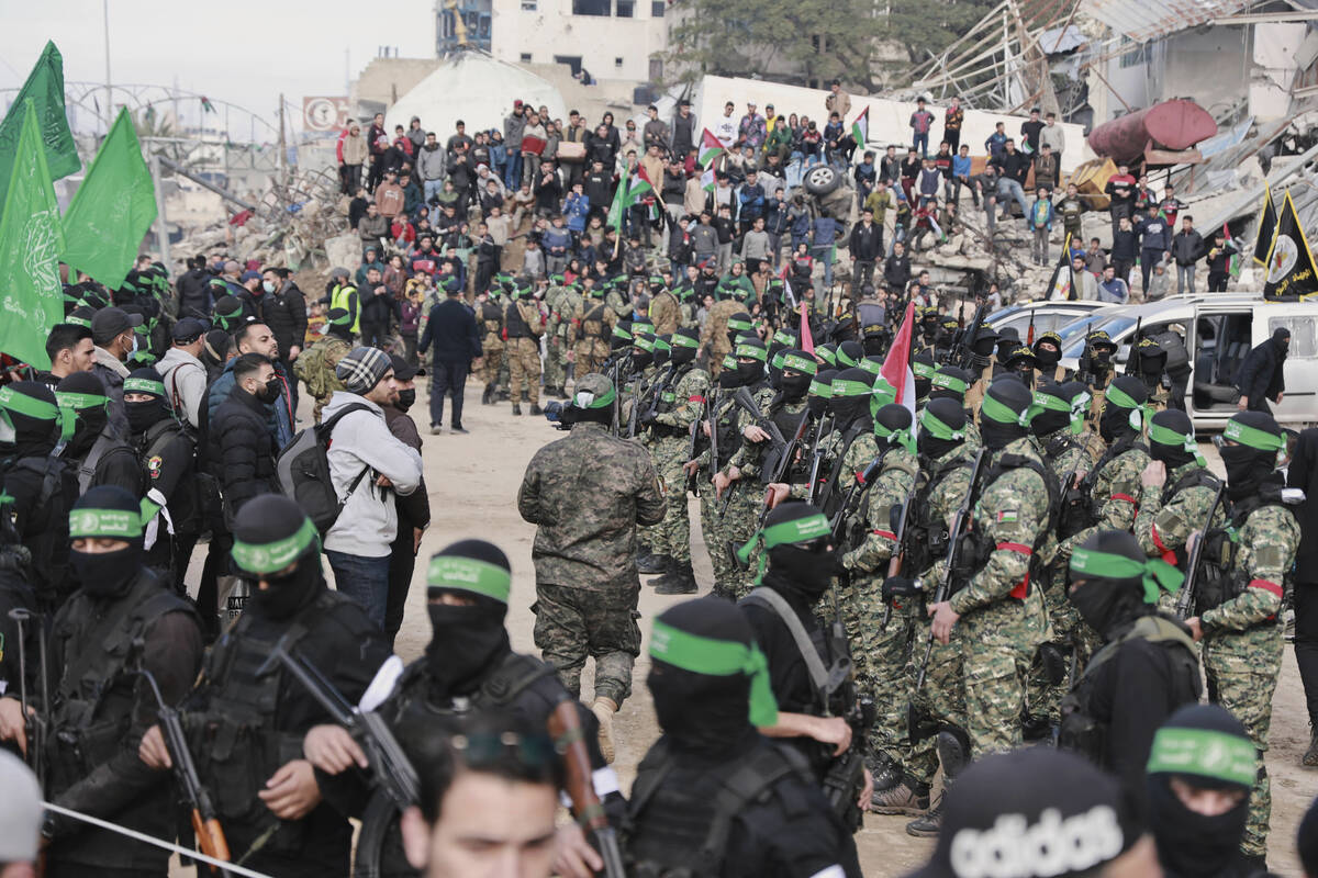 Hamas and Islamic Jihad fighters are deployed in central Gaza City ahead of the planned release ...