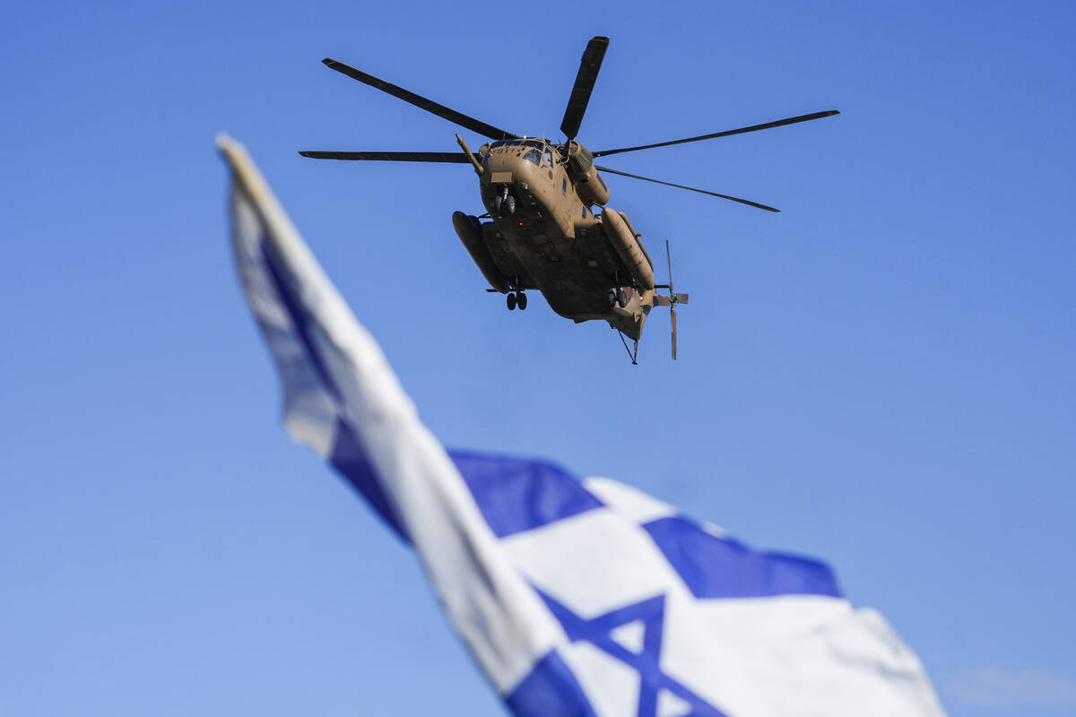 An Israeli military helicopter, carrying the four Israeli female soldier released from Gaza, ar ...