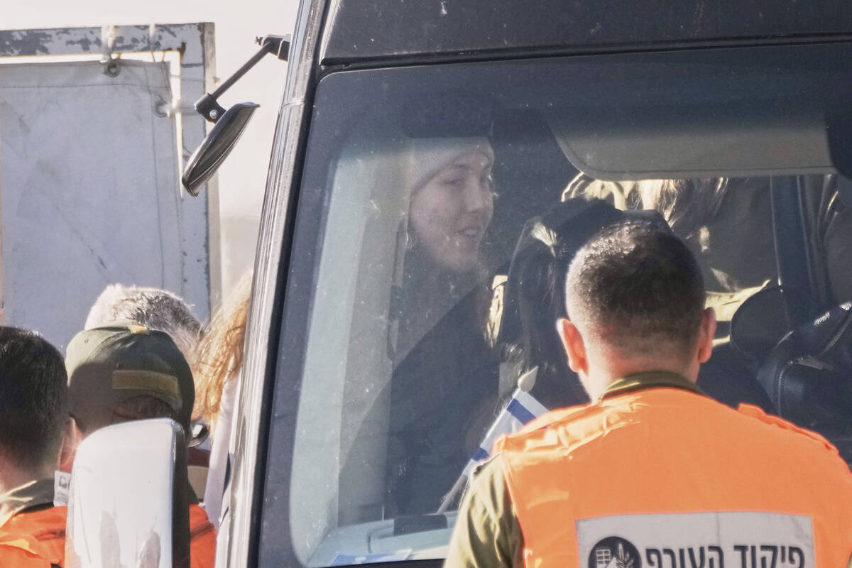 Israeli soldier Naama Levy, who was kidnapped in Gaza by Hamas on Oct. 7, gets on a bus after l ...