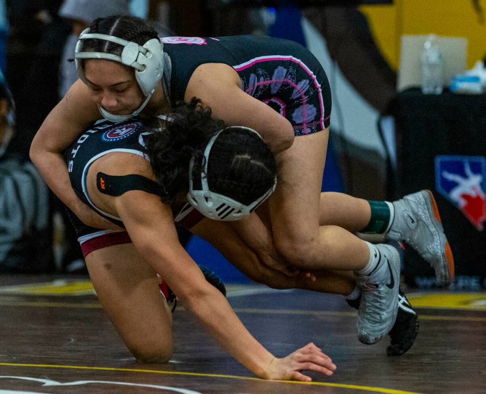 SLAM Academy’s Noelani Lutz turns Liberty’s Chanity Faleto onto the mat during th ...