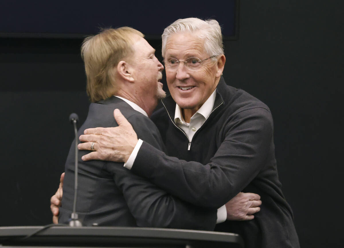 Raiders owner Mark Davis, left, greets Pete Carroll after introducing him as the new head coach ...