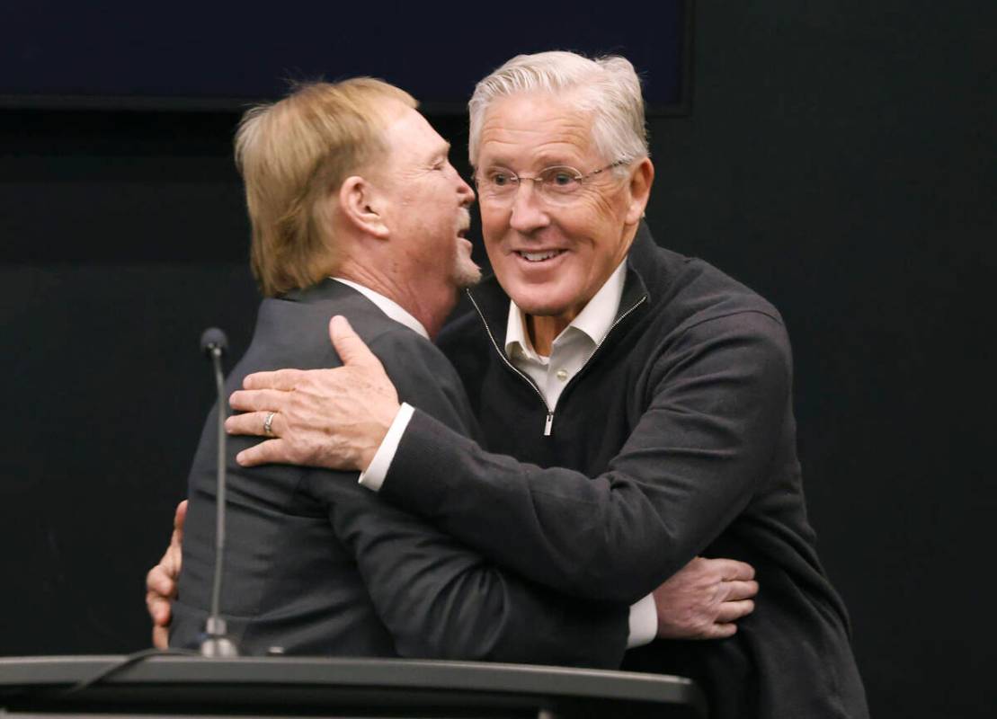 Raiders owner Mark Davis, left, greets Pete Carroll after introducing him as the new head coach ...