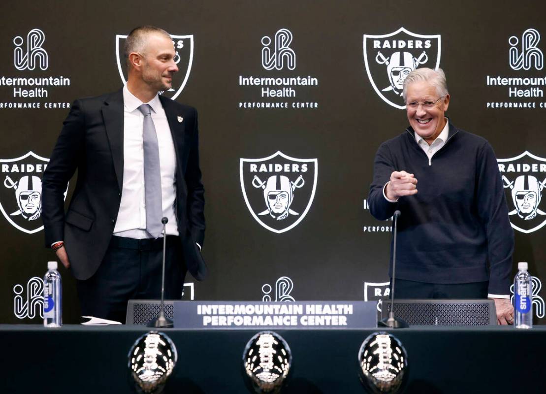 The new Raiders general manager John Spytek, left, watches as new head coach Pete Carroll react ...