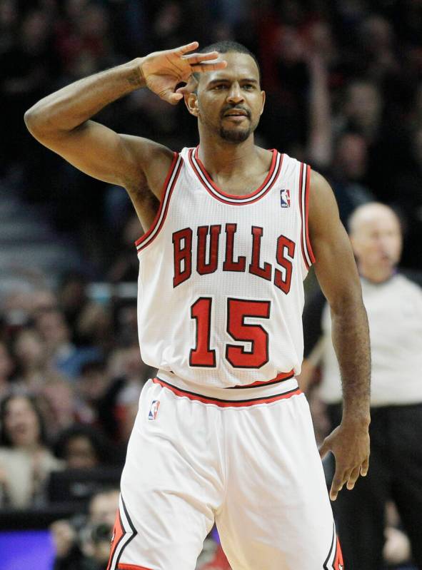 Chicago Bulls' John Lucas III (15) reacts after hitting a 3-point shot during the fourth quarte ...