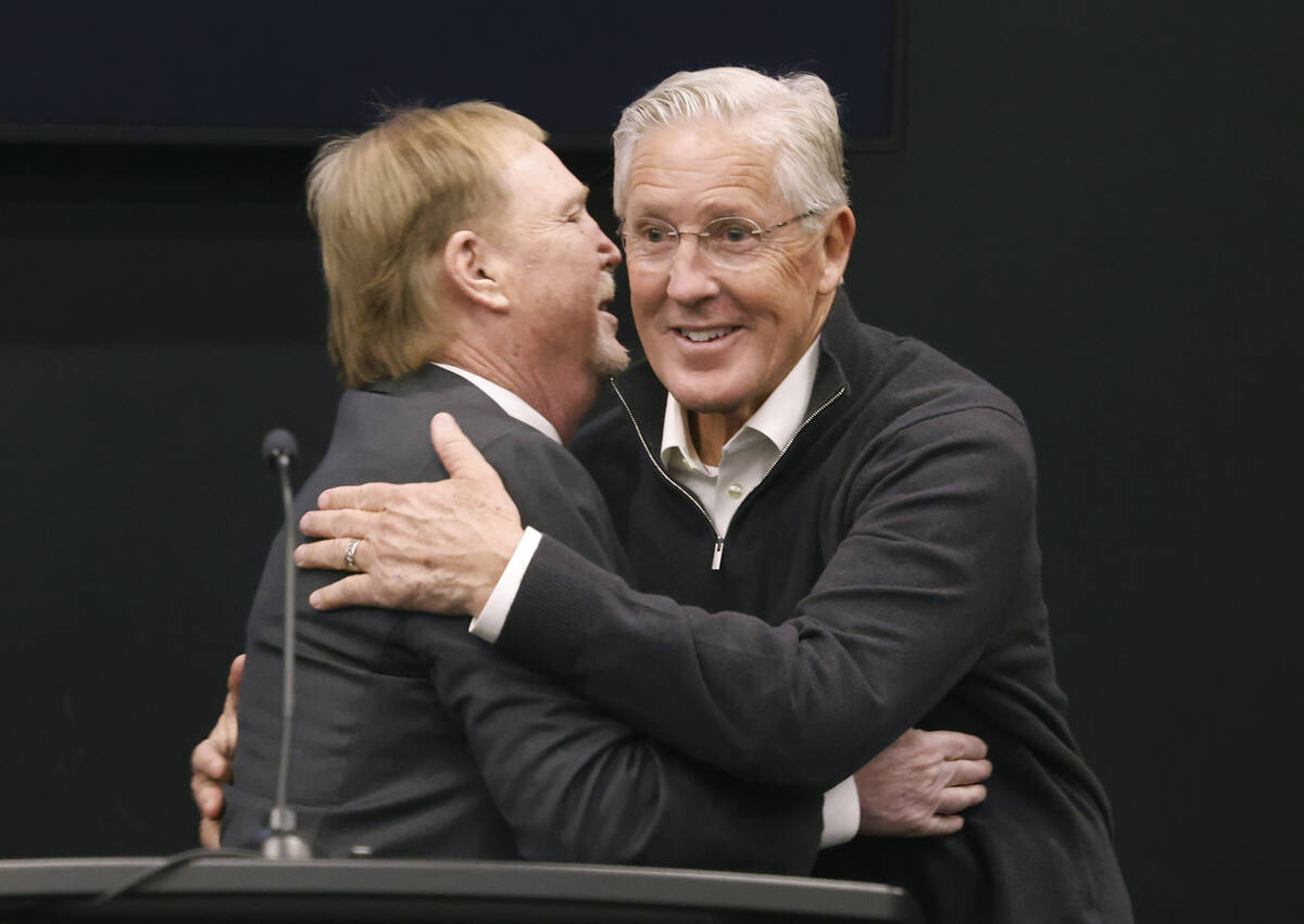 Raiders owner Mark Davis, left, greets Pete Carroll after introducing him as the new head coach ...