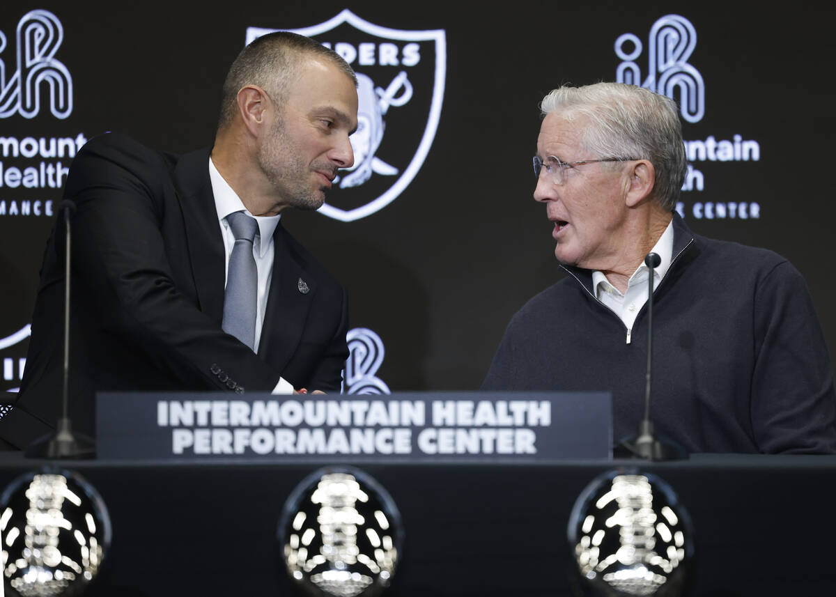 The new Raiders general manager John Spytek, left, and new head coach Pete Carroll shake hands ...