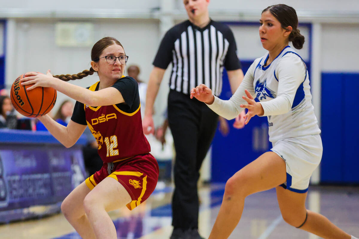 Del Sol guard Rosie Diaz (12) looks for an open teammate during a girls basketball game between ...