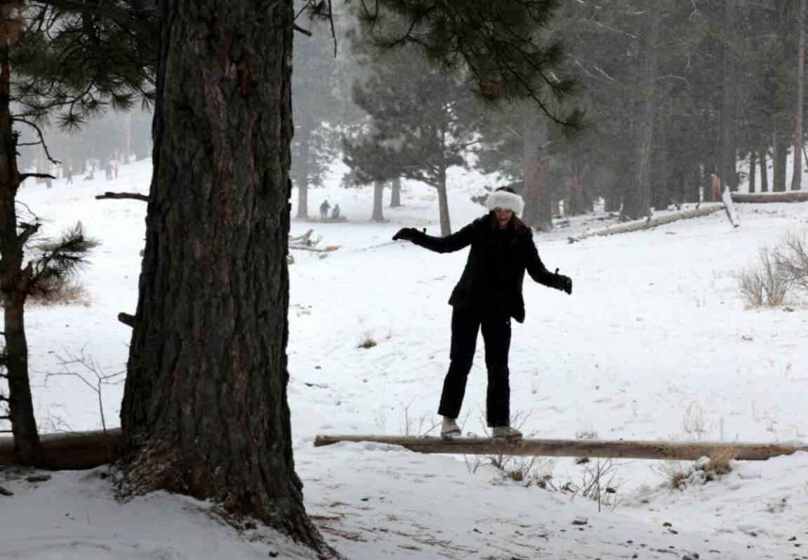 Samantha Somers of Las Vegas plays in a light snow in Upper Lee Meadows on Mount Charleston nor ...