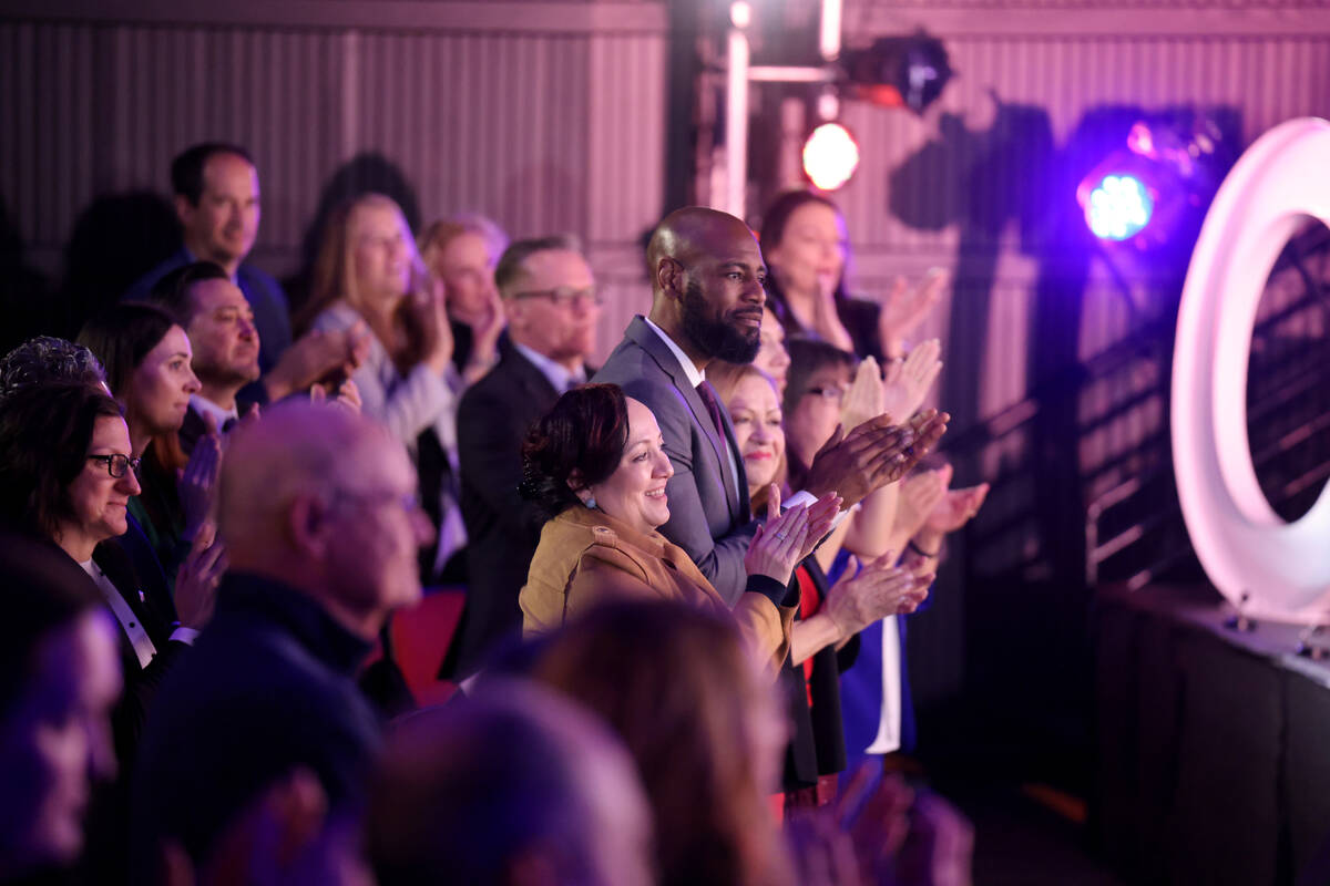 Members of the audience applaud for the Gilbert Academy of the Creative Arts Collage, who perfo ...