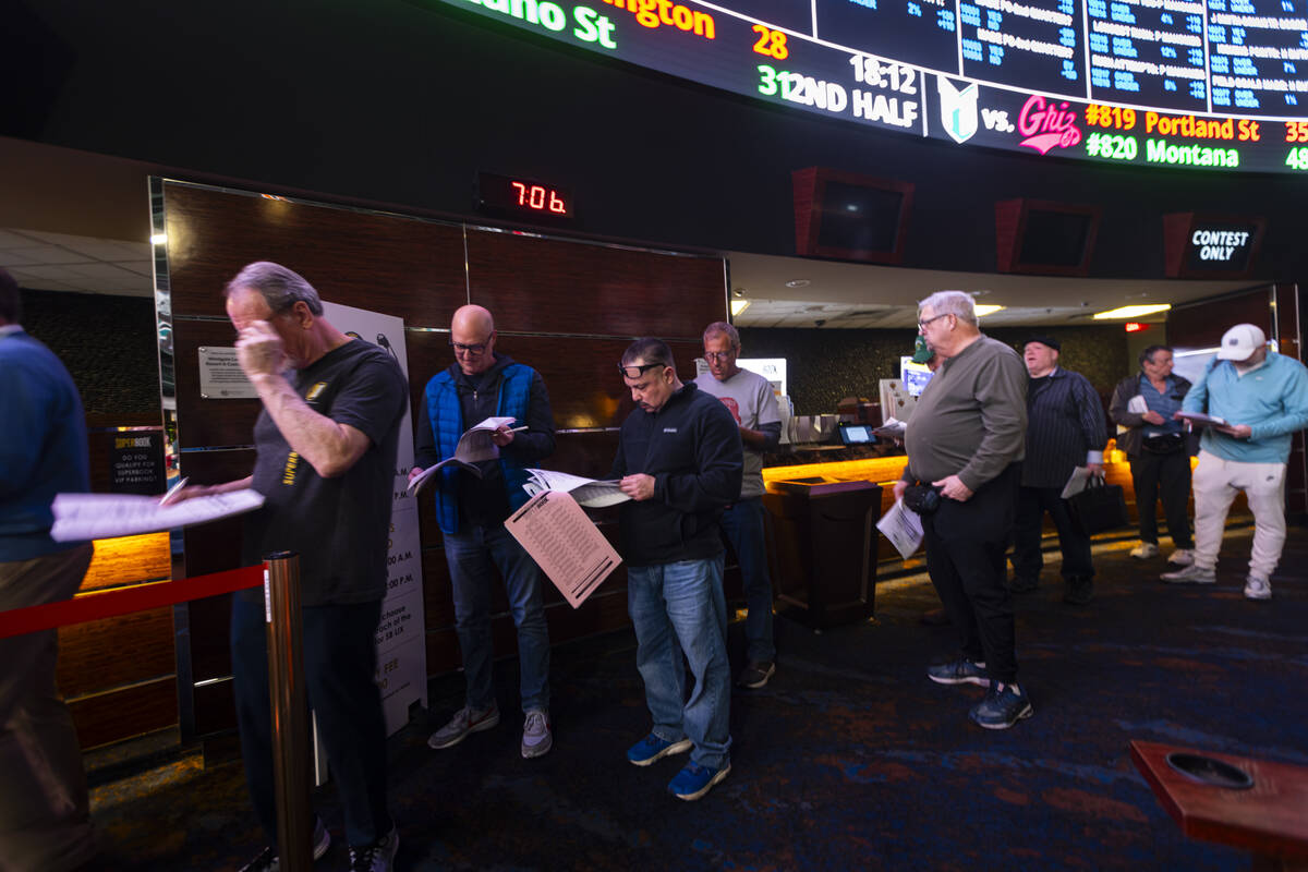 People wait in line to place bets after prop bets were posted at the Westgate Superbook for Sup ...