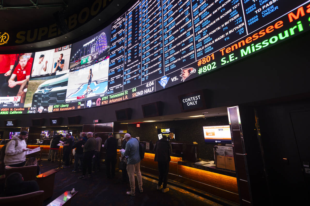 People wait in line to place bets after prop bets were posted at the Westgate Superbook for Sup ...