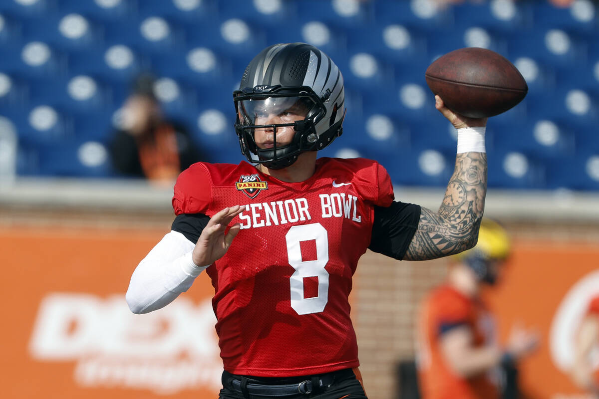 National team quarterback Dillon Gabriel of Oregon throws a pass as he runs through drills duri ...