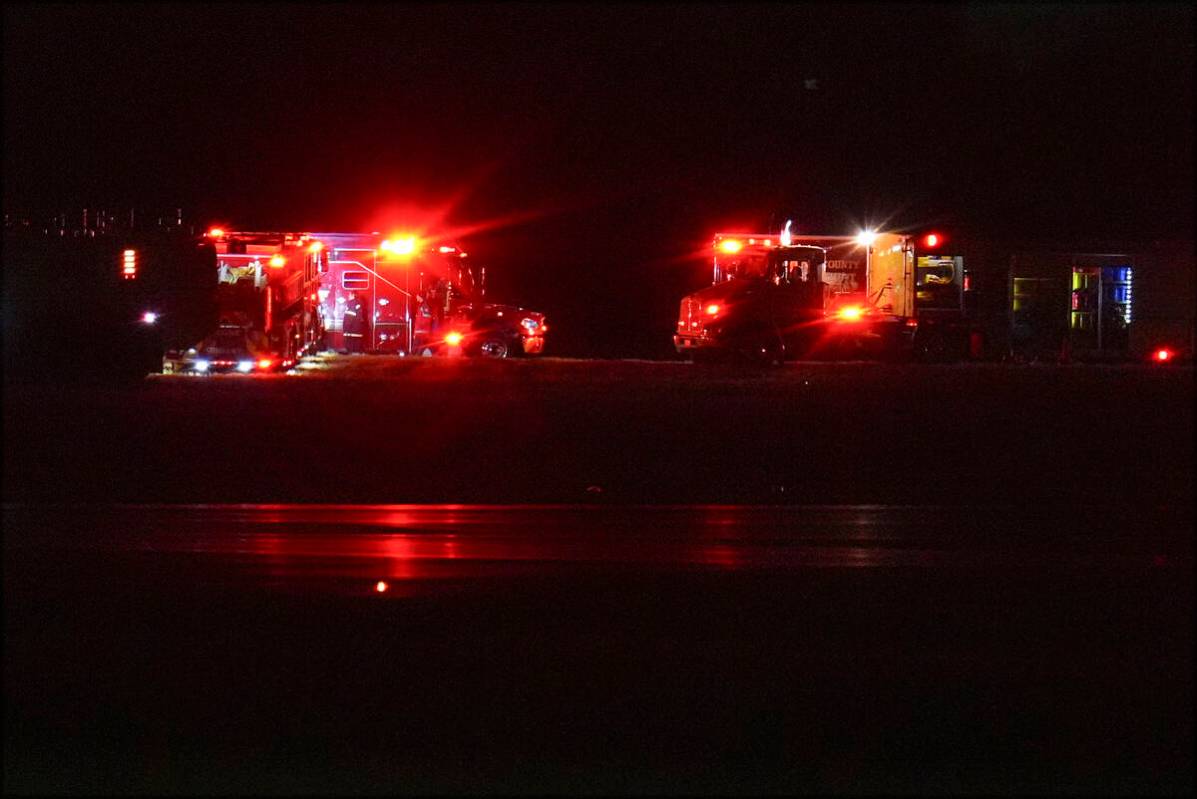 First responders are seen at Ronald Reagan Washington National Airport, Wednesday, Jan. 29, 202 ...