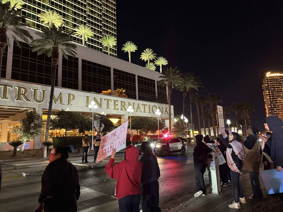 About 30 people gathered across the street from the Trump International hotel on Wednesday, Jan ...