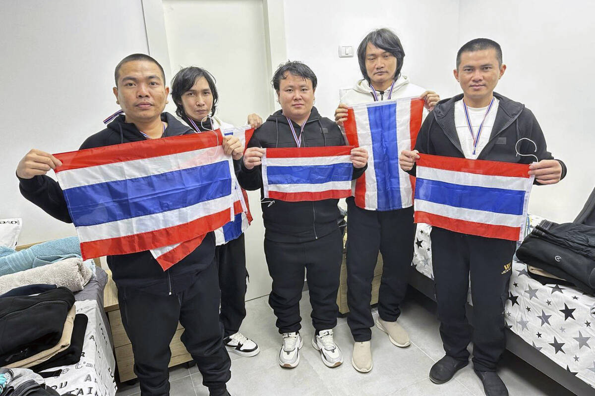 CORRECTS ID - Thai hostages who were freed from Hamas, from left to right, Surasak Rumnao, Sath ...